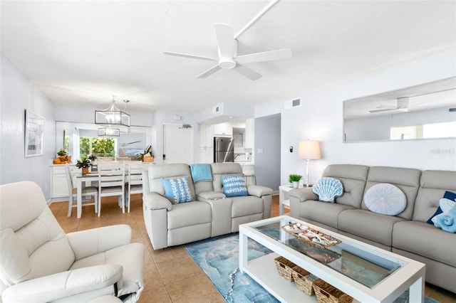 6312 Midnight Pass Rd Unit 102S, Sarasota, FL 34242 - living room with light tile patterned floors, ceiling fan, and a chandelier