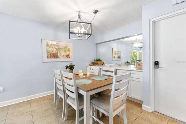 6312 Midnight Pass Rd Unit 102S, Sarasota, FL 34242 - dining room featuring a chandelier and light tile patterned flooring