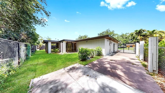 4455 Emerald Ridge Dr, Sarasota, FL 34233 - exterior space with a gate and concrete driveway