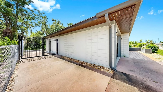 4455 Emerald Ridge Dr, Sarasota, FL 34233 - view of property exterior featuring a gate