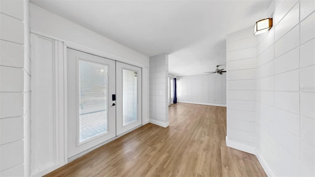 4455 Emerald Ridge Dr, Sarasota, FL 34233 - hallway with french doors and wood finished floors