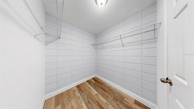 4455 Emerald Ridge Dr, Sarasota, FL 34233 - spacious closet featuring wood finished floors
