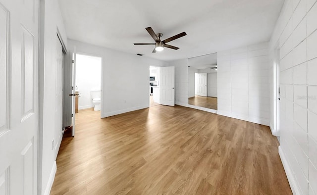 4455 Emerald Ridge Dr, Sarasota, FL 34233 - unfurnished bedroom featuring light wood finished floors, a ceiling fan, and ensuite bath
