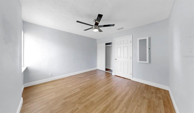 4455 Emerald Ridge Dr, Sarasota, FL 34233 - unfurnished bedroom featuring light wood-type flooring, a closet, and a ceiling fan