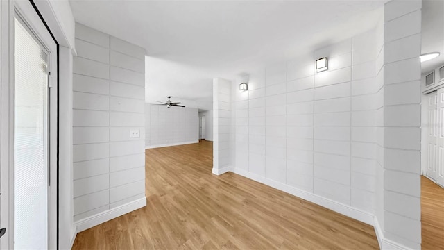 4455 Emerald Ridge Dr, Sarasota, FL 34233 - hallway featuring light wood-type flooring