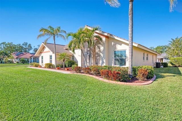 1144 Hoover St, Nokomis, FL 34275 - view of front of house featuring stucco siding and a front yard