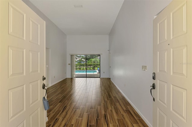 1144 Hoover St, Nokomis, FL 34275 - foyer featuring dark wood-type flooring and baseboards