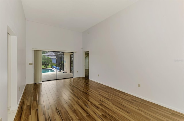 1144 Hoover St, Nokomis, FL 34275 - spare room with wood finished floors and a high ceiling
