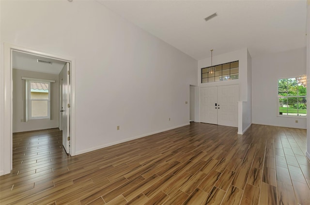 1144 Hoover St, Nokomis, FL 34275 - foyer with wood finished floors, healthy amount of natural light, and a high ceiling