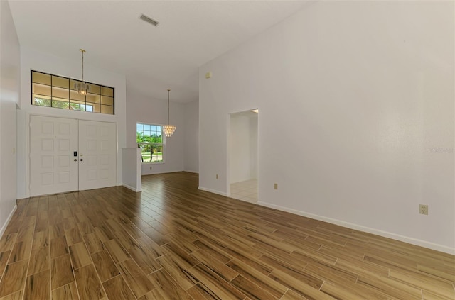 1144 Hoover St, Nokomis, FL 34275 - entryway featuring a chandelier and light wood-type flooring