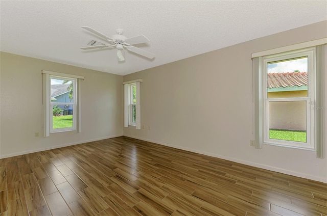 1144 Hoover St, Nokomis, FL 34275 - unfurnished room featuring wood finished floors and a ceiling fan