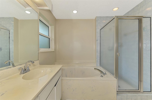 1144 Hoover St, Nokomis, FL 34275 - bathroom featuring vanity, a stall shower, a bath, a textured ceiling, and recessed lighting
