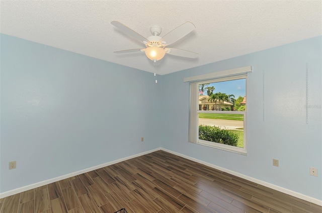 1144 Hoover St, Nokomis, FL 34275 - spare room with dark wood-style floors and ceiling fan
