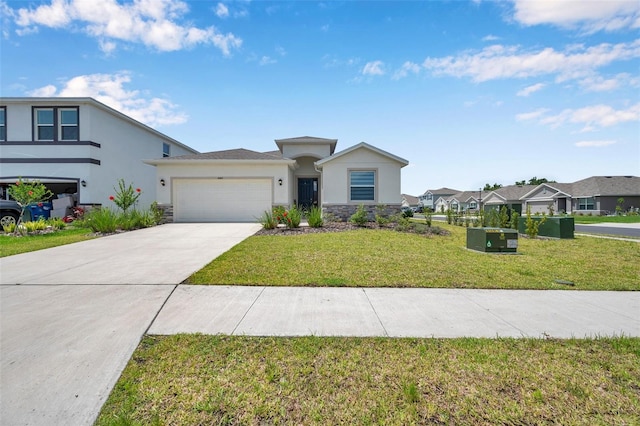 4405 Weathered Moss Gln, Palmetto, FL 34221 - view of front facade with stucco siding, a garage, stone siding, concrete driveway, and a front lawn