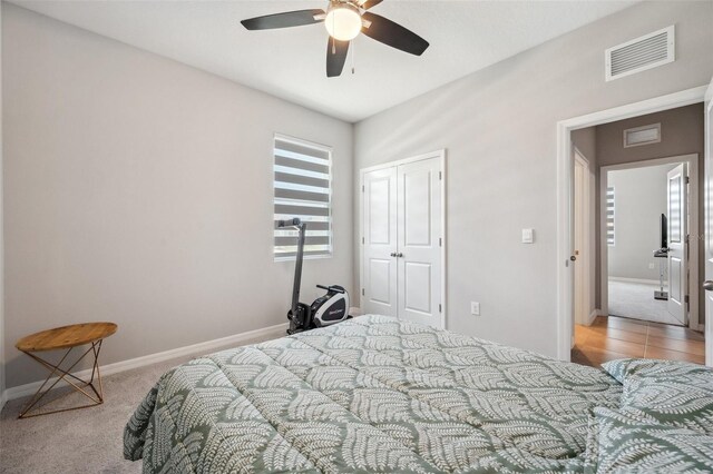 4405 Weathered Moss Gln, Palmetto, FL 34221 - bedroom with a closet, carpet, and a ceiling fan