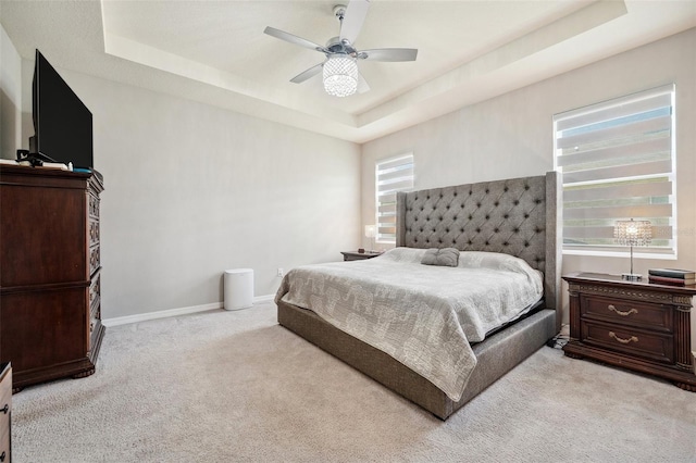 4405 Weathered Moss Gln, Palmetto, FL 34221 - bedroom with a tray ceiling, light carpet, and ceiling fan