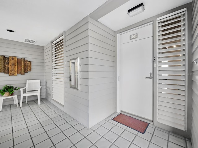 615 Dream Island Pl Unit 105, Longboat Key, FL 34228 - doorway to property featuring a porch