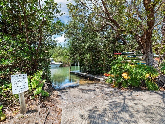 615 Dream Island Pl Unit 105, Longboat Key, FL 34228 - dock area featuring a boat ramp and a water view
