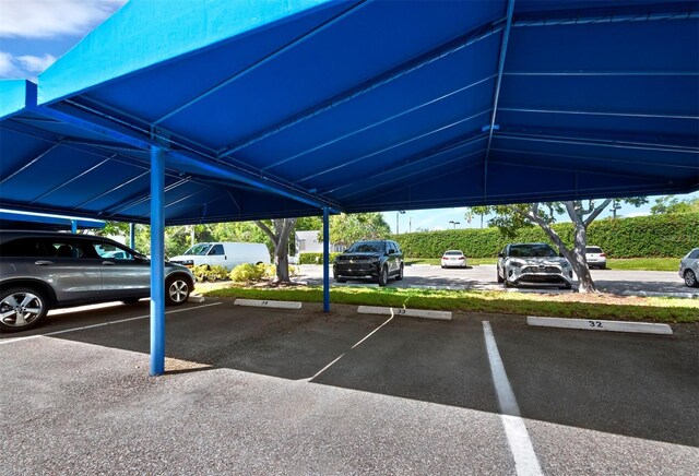 615 Dream Island Pl Unit 105, Longboat Key, FL 34228 - view of covered parking lot