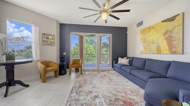 1921 Monte Carlo Dr Unit 302, Sarasota, FL 34231 - living area featuring a ceiling fan and baseboards