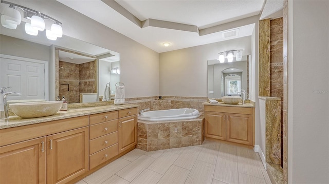 1921 Monte Carlo Dr Unit 302, Sarasota, FL 34231 - full bathroom featuring vanity, a garden tub, and a tile shower