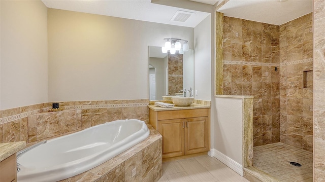 1921 Monte Carlo Dr Unit 302, Sarasota, FL 34231 - full bathroom featuring a garden tub, vanity, a tile shower, and tile patterned flooring