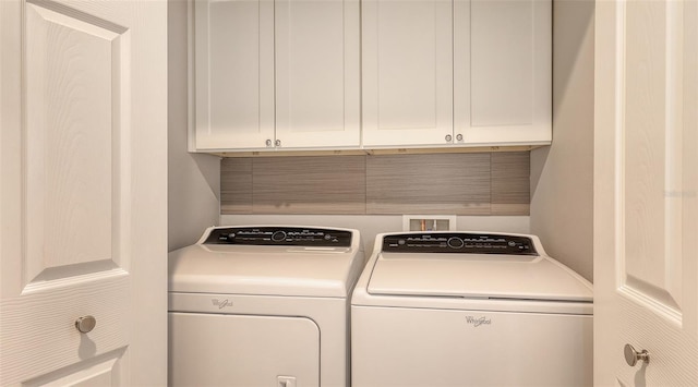1921 Monte Carlo Dr Unit 302, Sarasota, FL 34231 - laundry room with washer and clothes dryer and cabinet space