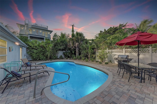 160 Coolidge Dr, Sarasota, FL 34236 - view of swimming pool with a patio area, a fenced backyard, outdoor dining space, and a grill