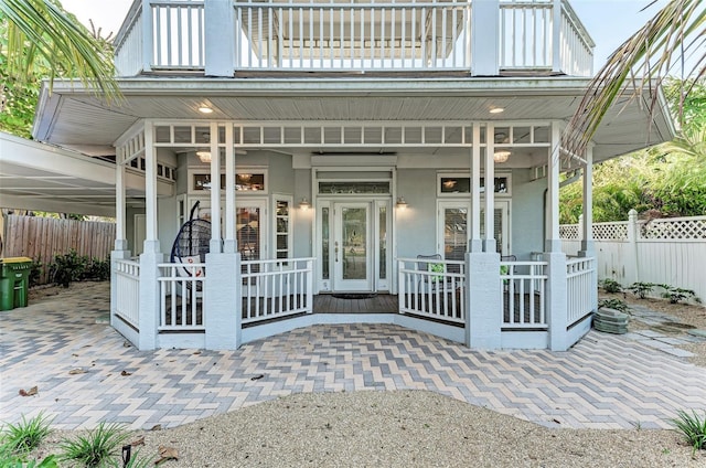 160 Coolidge Dr, Sarasota, FL 34236 - rear view of property with covered porch and a balcony