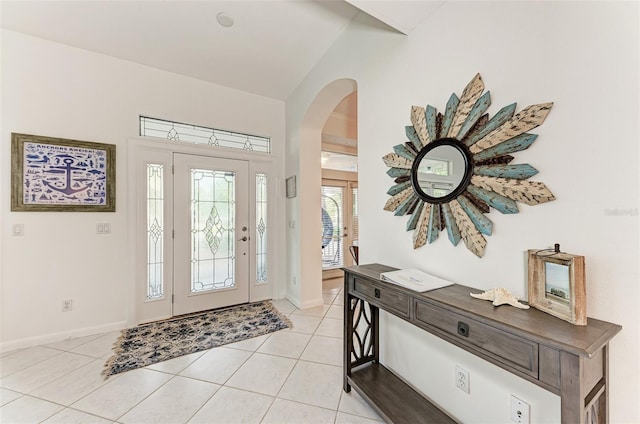 160 Coolidge Dr, Sarasota, FL 34236 - entrance foyer featuring arched walkways, light tile patterned floors, and vaulted ceiling
