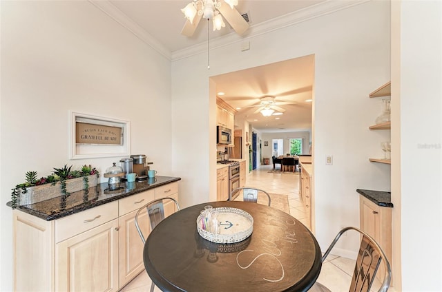 160 Coolidge Dr, Sarasota, FL 34236 - dining area featuring a ceiling fan, light tile patterned flooring, and ornamental molding