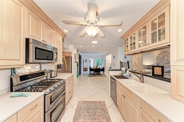 160 Coolidge Dr, Sarasota, FL 34236 - kitchen featuring appliances with stainless steel finishes, light countertops, light brown cabinets, and recessed lighting