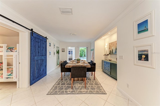 160 Coolidge Dr, Sarasota, FL 34236 - dining space featuring ornamental molding, a barn door, and light tile patterned flooring