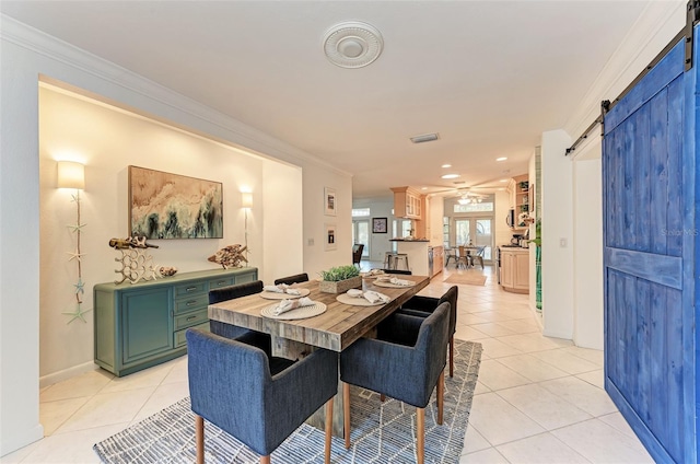 160 Coolidge Dr, Sarasota, FL 34236 - dining area with a barn door, light tile patterned floors, ceiling fan, crown molding, and recessed lighting