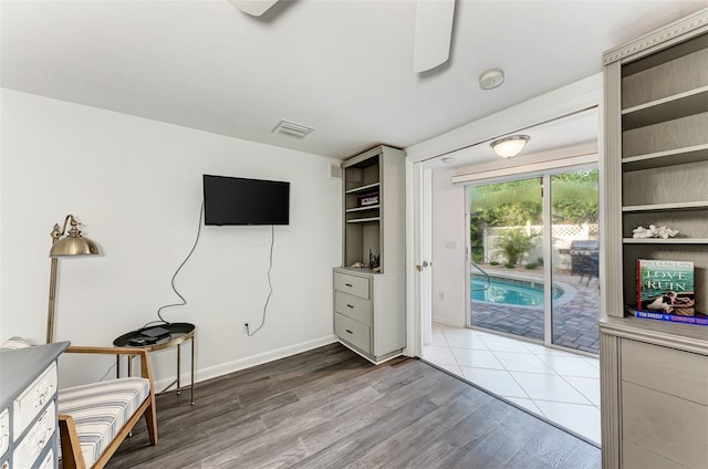 160 Coolidge Dr, Sarasota, FL 34236 - sitting room with wood finished floors and baseboards