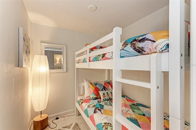 160 Coolidge Dr, Sarasota, FL 34236 - bedroom with tile patterned floors and baseboards