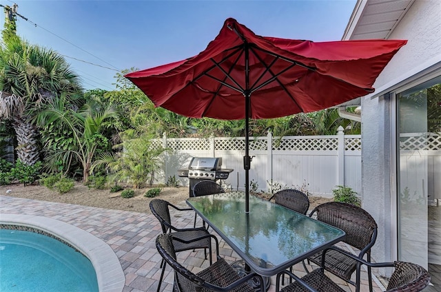 160 Coolidge Dr, Sarasota, FL 34236 - view of patio / terrace with outdoor dining space and a grill