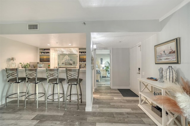 1740 Alderman St Unit 7, Sarasota, FL 34236 - kitchen with wood finished floors and a kitchen bar