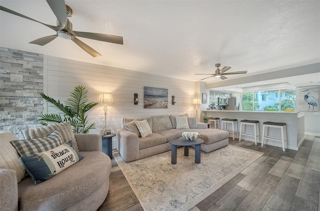 1740 Alderman St Unit 7, Sarasota, FL 34236 - living room featuring a ceiling fan, wood finished floors, and wooden walls