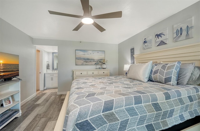 1740 Alderman St Unit 7, Sarasota, FL 34236 - bedroom with wood finished floors, connected bathroom, and a ceiling fan