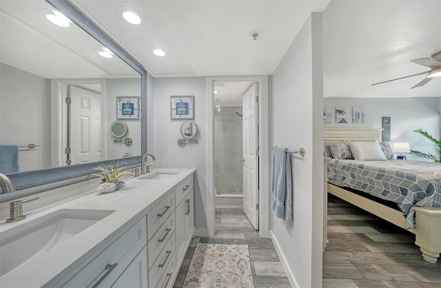 1740 Alderman St Unit 7, Sarasota, FL 34236 - ensuite bathroom with wood finished floors, a shower stall, a ceiling fan, double vanity, and recessed lighting
