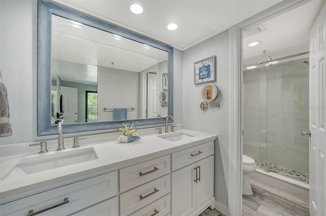 1740 Alderman St Unit 7, Sarasota, FL 34236 - full bathroom with double vanity, a stall shower, wood finished floors, and recessed lighting