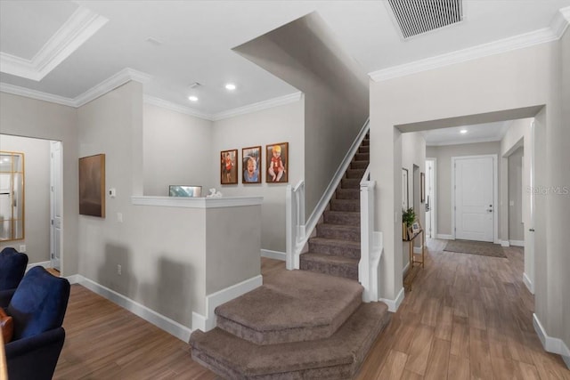 3344 Anchor Bay Trl, Bradenton, FL 34211 - entryway featuring wood finished floors, stairway, recessed lighting, and crown molding
