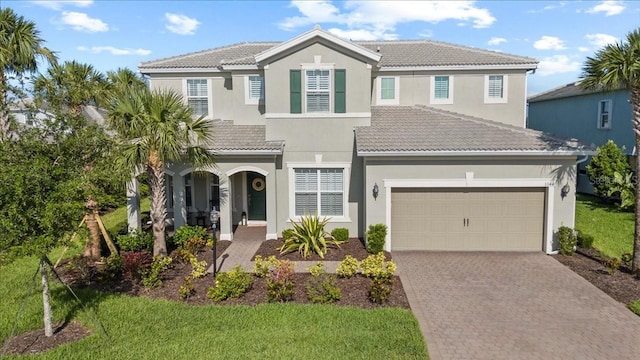 3344 Anchor Bay Trl, Bradenton, FL 34211 - view of front of home featuring a tiled roof, decorative driveway, and stucco siding