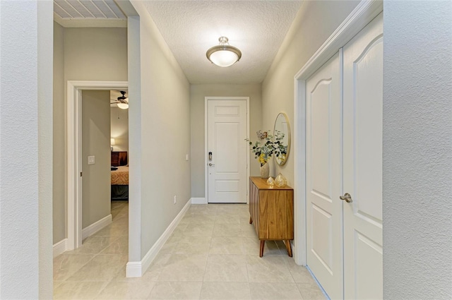 11685 Great Brook Ln, Parrish, FL 34219 - entryway featuring light tile patterned floors and a textured ceiling