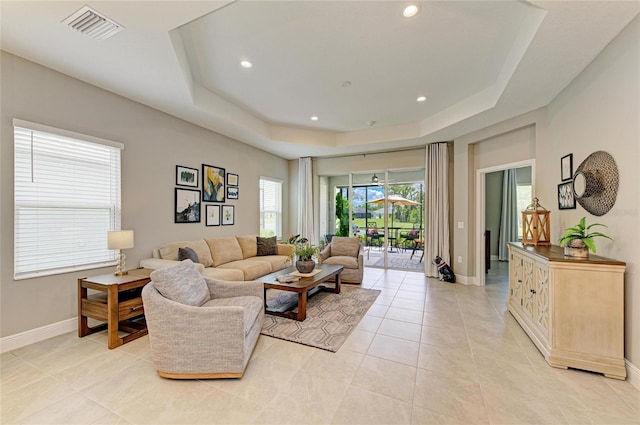 11685 Great Brook Ln, Parrish, FL 34219 - living area with a tray ceiling, light tile patterned flooring, and recessed lighting