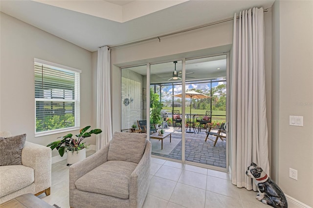 11685 Great Brook Ln, Parrish, FL 34219 - doorway with light tile patterned floors and ceiling fan