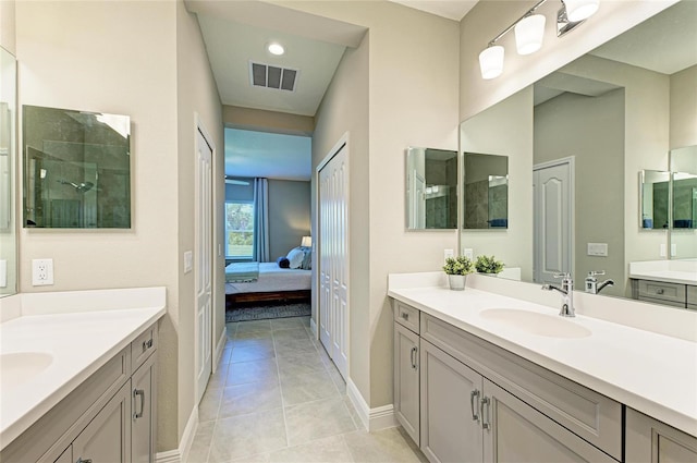 11685 Great Brook Ln, Parrish, FL 34219 - full bathroom with two vanities, ensuite bathroom, tile patterned flooring, and a tile shower
