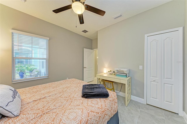11685 Great Brook Ln, Parrish, FL 34219 - bedroom with light tile patterned floors, ceiling fan, and a closet