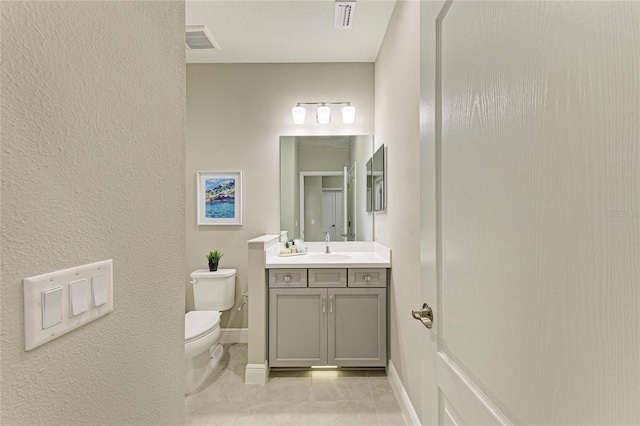 11685 Great Brook Ln, Parrish, FL 34219 - bathroom featuring vanity, tile patterned floors, and a textured wall